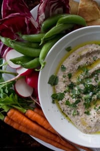 2022_RoastedRadishHummus_28_web Roasted Radish hummus plated with fresh carrots, sweet peas, fresh radishes, raddichio and flatbread